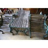 Four cast metal slatted wood garden armchairs and matching rectangular table, table width 126cm