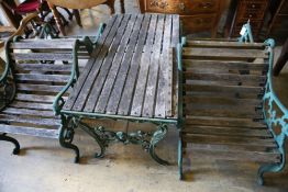 Four cast metal slatted wood garden armchairs and matching rectangular table, table width 126cm