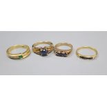 An 750, emerald and diamond asymmetric ring, size L, gross 4 grams, a 750 channel-set sapphire and