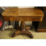 An early Victorian rosewood card table, having D-shaped folding top lined with foliate-decorated