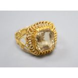 A filigree yellow metal and citrine set dress ring, size N, gross 6.5 grams.CONDITION: Possible