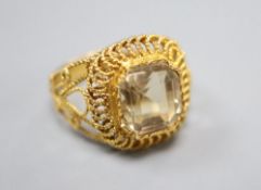 A filigree yellow metal and citrine set dress ring, size N, gross 6.5 grams.CONDITION: Possible