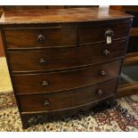 A bow-fronted mahogany chest fitted two two short drawers and three long drawers with beaded