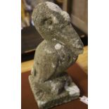 A reconstituted stone pelican garden ornament, height 44cm