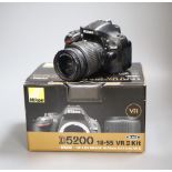 A boxed Nikon D5200 SLR VRII kit with 18-55 mm lens