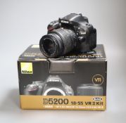 A boxed Nikon D5200 SLR VRII kit with 18-55 mm lens