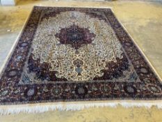 A large Persian cream ground carpet, 280 x 387cmCONDITION: Dirty in places, brown staining in one