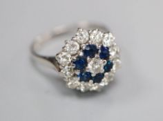 A 1970's 18ct white gold, sapphire and diamond hexagonal cluster ring, size L, gross 4.3 grams.