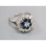 A 1970's 18ct white gold, sapphire and diamond hexagonal cluster ring, size L, gross 4.3 grams.