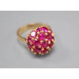 A mid to late 20th century Italian? 750 and synthetic? ruby cluster dress ring, size M/N, gross 8.