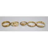 Four assorted 9ct gold rings, various, gross 9.3g and a wedding band marked 585, 2g.CONDITION: All