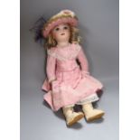 A French bisque head jointed doll, with pierced ears and paperweight cane eyes, with closed mount