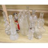 Nine moulded glass bottles, including one coloured and formed as a matador tallest 33cmCONDITION: