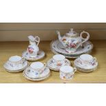 A group of Dresden teawaresCONDITION: One cup and one saucer have a crack to the base, all items the