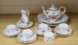 A group of Dresden teawaresCONDITION: One cup and one saucer have a crack to the base, all items the