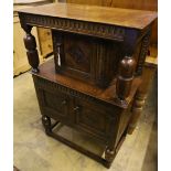 A small reproduction oak court cupboard, width 70cm depth 37cm height 106cm