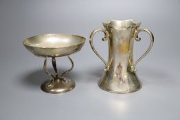 An Edwardian silver three handled vase, Sheffield, 1909, 11.1cm and a small dish on tripod supports,