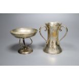 An Edwardian silver three handled vase, Sheffield, 1909, 11.1cm and a small dish on tripod supports,