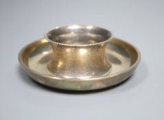 A silver circular ashtray, London, 1932 and a later silver serviette ring, gross 4oz.CONDITION: Both