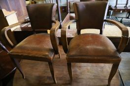 A pair of Art Deco leather elbow chairs