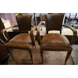 A pair of Art Deco leather elbow chairs