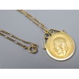 A 1914 half sovereign in 9ct gold mount on 9ct gold chain, gross 8.4g.