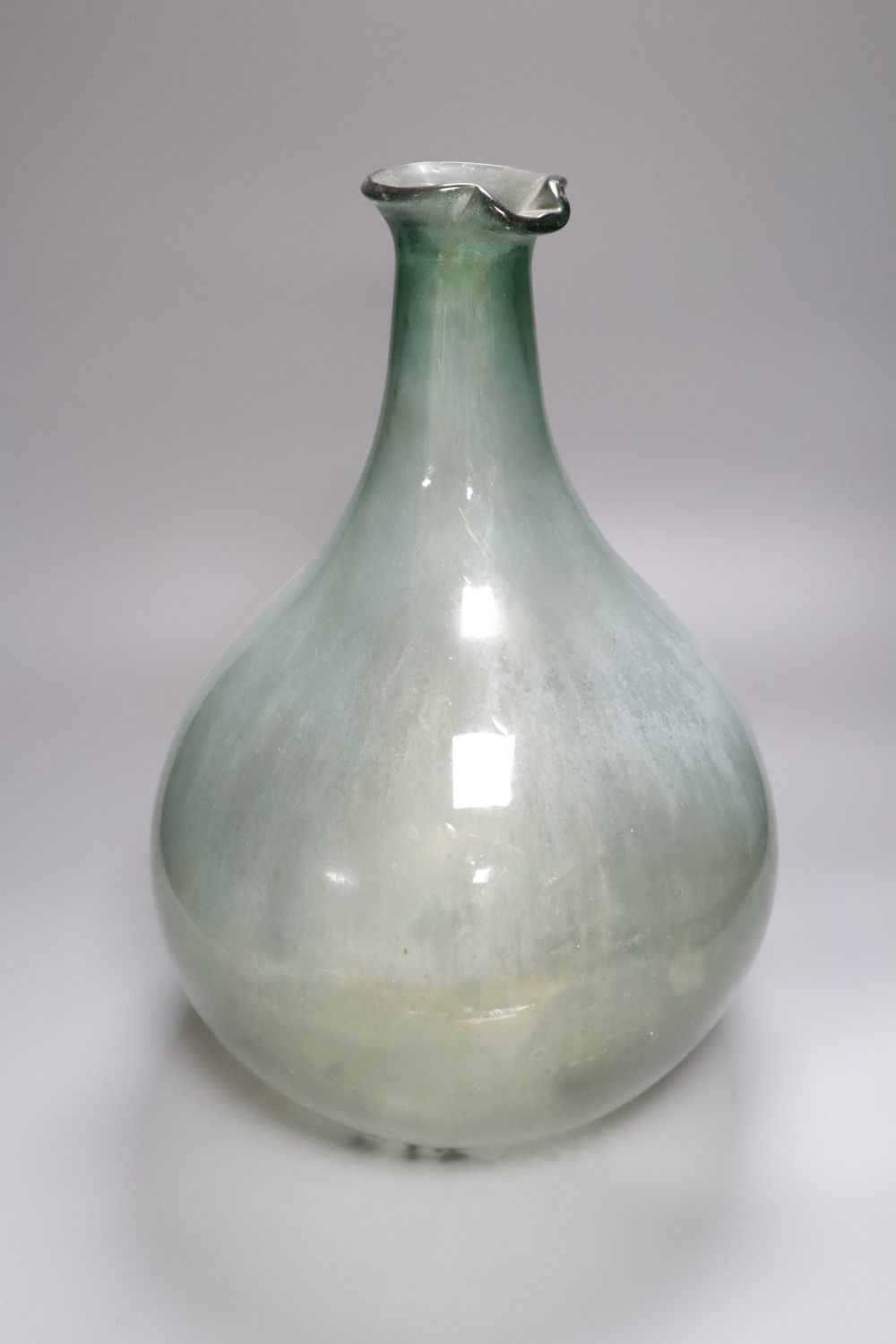 An olive glass demi-john, probably 19th century French 42cm highCONDITION: Provenance - Andrew