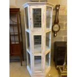 A modern white and pink marble effect painted display case, width 76cm height 181cmCONDITION: Two