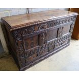 A 17th century carved oak and marquetry inlaid mule chest, with later top, width 140cm depth 53cm
