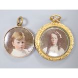 A late Victorian 9ct double sided glazed locket, 33mm and other yellow metal mounted glazed pendant,