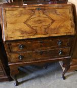 A 1930's Queen Anne style figured walnut bureau, width 72cm depth 44cm height 89cm