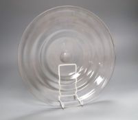 A Whitefriars ribbed clear glass dish, 1920/30s, 34cm diameterCONDITION: Provenance - Andrew