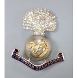 A yellow and white metal, enamel and white paste set 'The Indian Grenadiers' brooch, 43mm gross 12.2