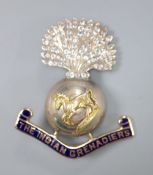 A yellow and white metal, enamel and white paste set 'The Indian Grenadiers' brooch, 43mm gross 12.2