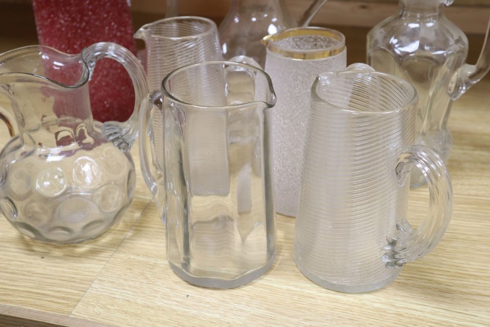 Nine various 19/20th century glass jugs, including a ruby crackle glass jug, tallest 25. - Image 4 of 5