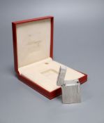 A Dupont silver plated cigarette lighter, in original case with dated receipt '99CONDITION: Good