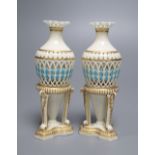 Manner of George Owen. A pair of unmarked Worcester reticulated amphora-vases, raised on tri-form