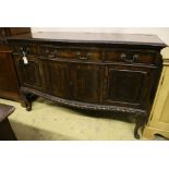 A 1920's Chippendale revival mahogany bowfront sideboard, width 152cm depth 63cm height 100cm