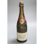One bottle of Bollinger Brut Champagne, 1977CONDITION: Label is torn, gold foil is tarnished.