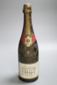 One bottle of Bollinger Brut Champagne, 1977CONDITION: Label is torn, gold foil is tarnished.