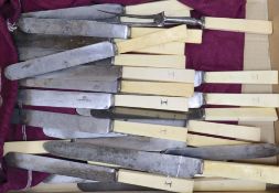 Twenty two 19th century ivory handled steel table knives and a carving knife and fork