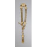 A 9ct gold double chain bracelet with engraved shaped box links, tassel suspension and bolt and ring