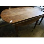 A 19th century French cherrywood circular drop leaf kitchen table, 144 x 104cm height 74cm