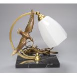 A French Art Deco 'seagull' table lamp, on marble base, stamped bronze, height 26cm