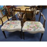 A pair of Hepplewhite style mahogany open armchairs