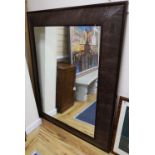 An Andrew Martin faux crocodile rectangular wall mirror, width 116cm height 148cm