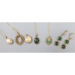 A 9ct gold and emerald heart pendant on chain, a 750 chain with scrolled pendant (vacant) and sundry