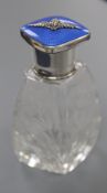 A George V silver and blue guilloche enamel mounted cut glass scent bottle, with R.A.F. applique,