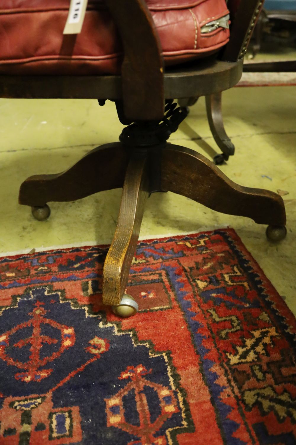 A 1920's oak swivel desk chair, the back and seat cushion covered in red hide, width 63cm, depth - Image 3 of 3