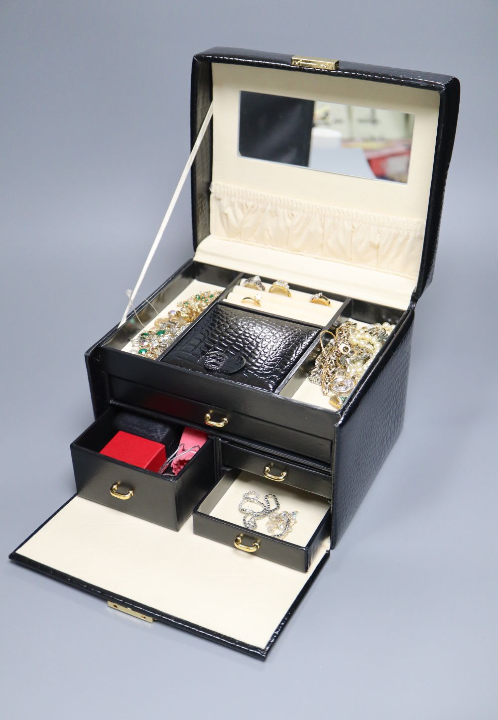 A faux crocodile jewellery box containing a 375 bracelet (11 grams), silver, costume, paste-set